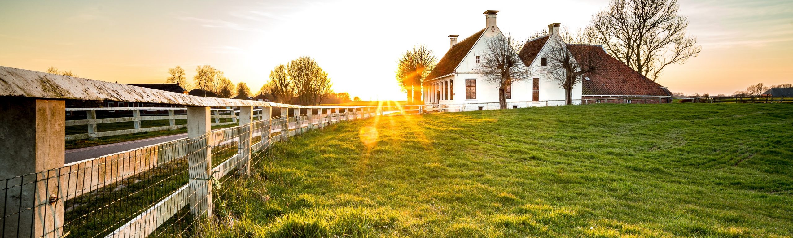 2_beautiful-shot-fence-leading-house-green-grass-area